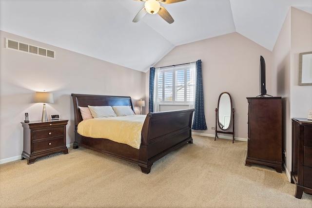 bedroom with ceiling fan, light carpet, and vaulted ceiling