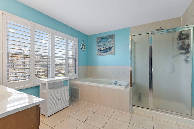 bathroom featuring tile patterned flooring, vanity, and independent shower and bath