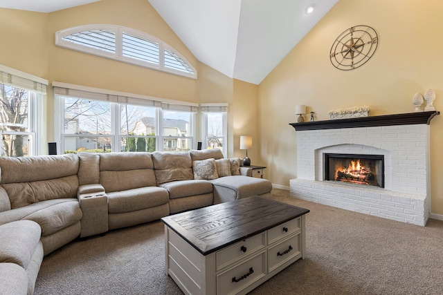 living room with dark carpet, high vaulted ceiling, and a brick fireplace