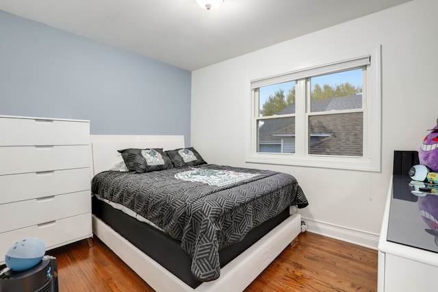 bedroom featuring dark hardwood / wood-style floors