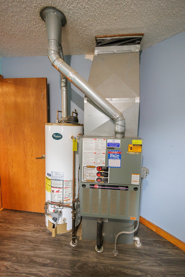 utility room with gas water heater and heating unit