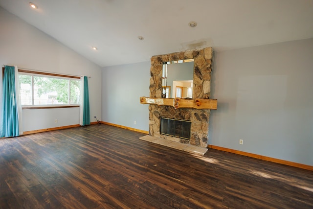 unfurnished living room featuring dark hardwood / wood-style floors, a fireplace, and high vaulted ceiling