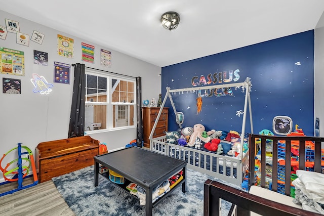 game room with wood finished floors