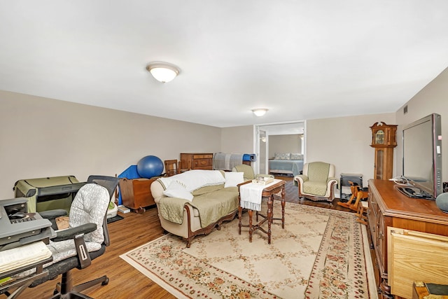 bedroom with wood finished floors