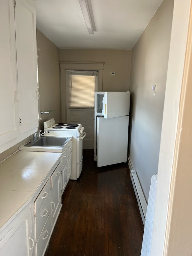 kitchen with white cabinets, white appliances, sink, and a baseboard radiator