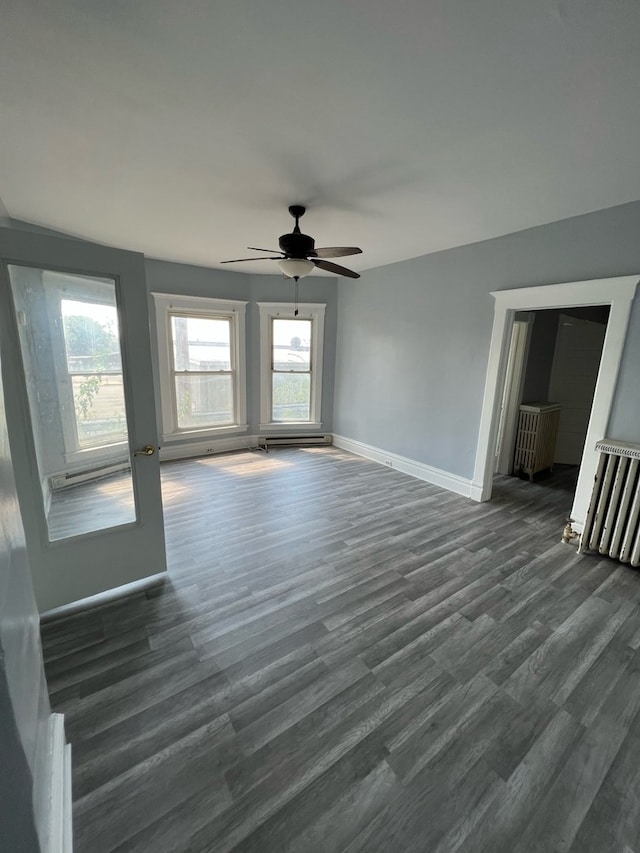 interior space featuring dark hardwood / wood-style flooring and ceiling fan