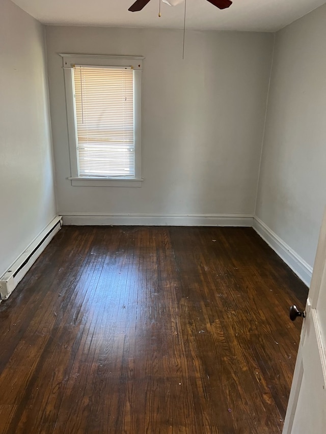 empty room with a baseboard radiator, ceiling fan, and dark wood-type flooring