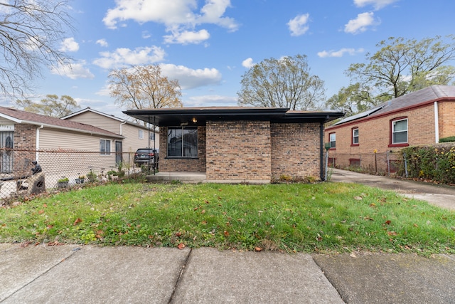 rear view of house with a yard