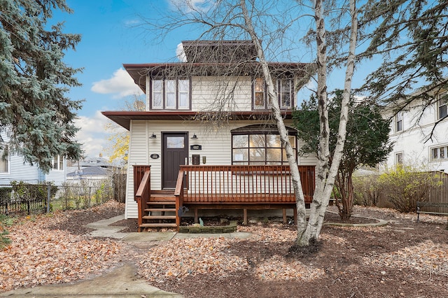 view of front of property with a wooden deck