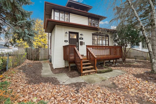 back of house featuring a deck