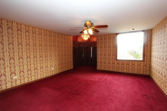 empty room with carpet and ceiling fan