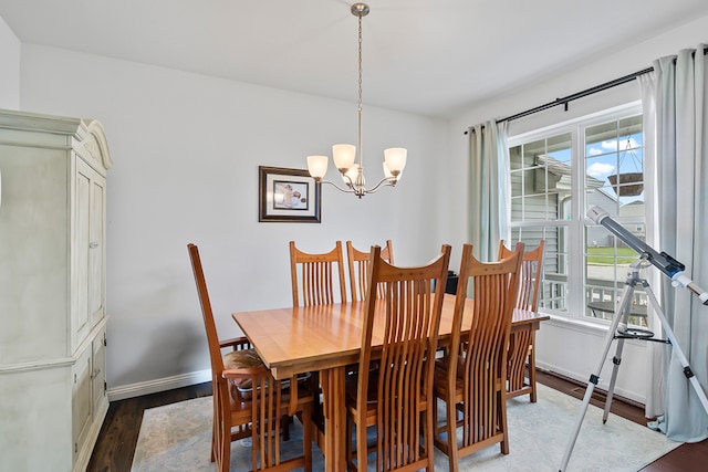 dining area featuring a chandelier and hardwood / wood-style flooring