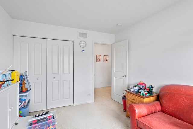 sitting room featuring carpet flooring