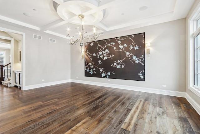 interior space featuring a notable chandelier, coffered ceiling, and hardwood / wood-style flooring