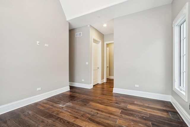 unfurnished room featuring dark hardwood / wood-style flooring