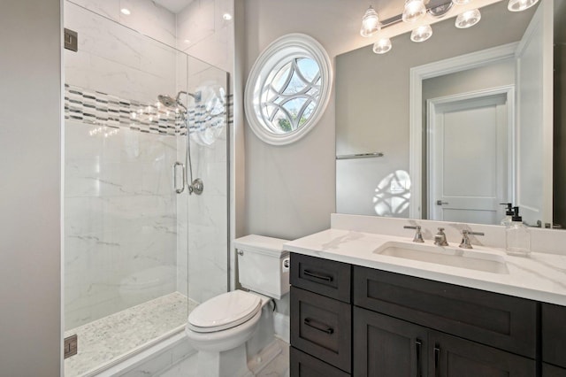 bathroom with toilet, a shower with door, and vanity