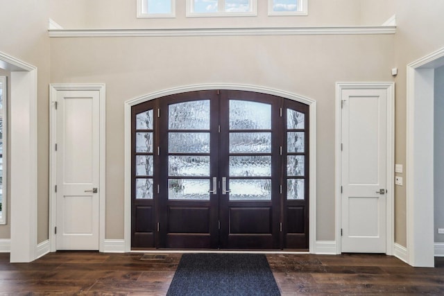 entryway featuring french doors and dark hardwood / wood-style flooring