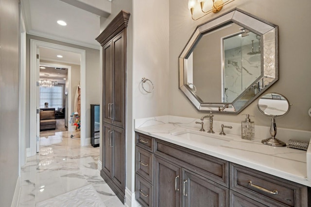 bathroom with vanity and ornamental molding