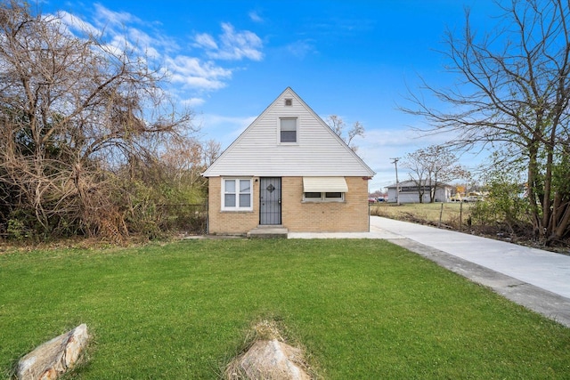 bungalow featuring concrete driveway, brick siding, and a front lawn