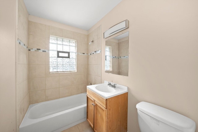 full bath featuring washtub / shower combination, tile patterned flooring, vanity, and toilet