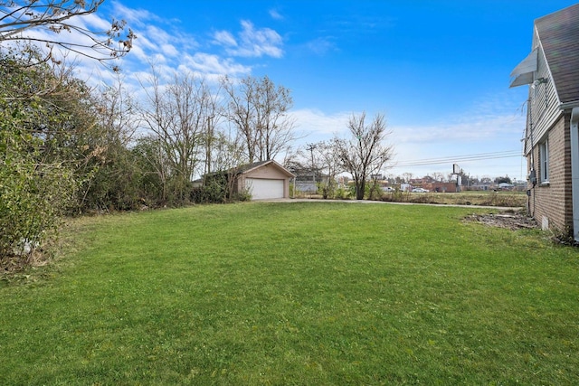 view of yard with a detached garage