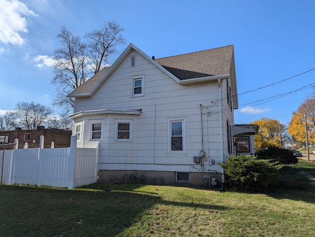 view of property exterior featuring a yard