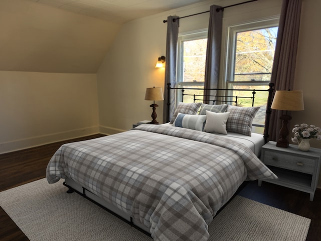 bedroom with dark hardwood / wood-style flooring and lofted ceiling