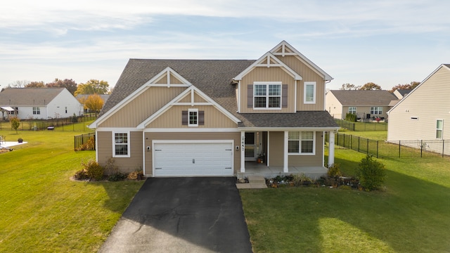 craftsman-style home with a garage and a front yard