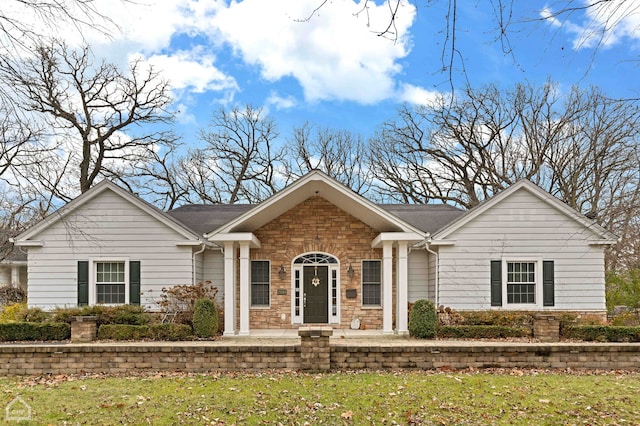 ranch-style house with a front lawn