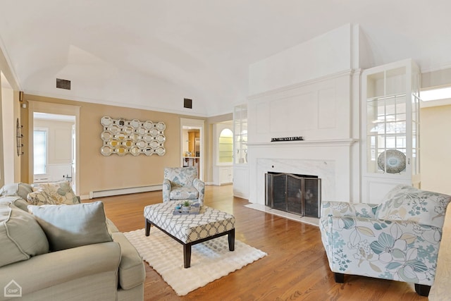 living room with a fireplace, wood-type flooring, lofted ceiling, and a baseboard heating unit