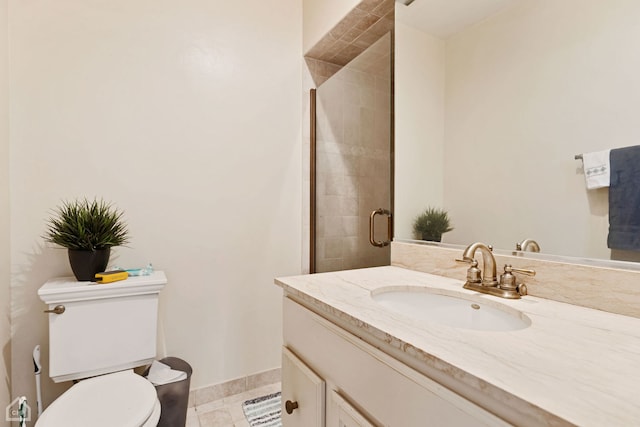 bathroom with tile patterned flooring, vanity, toilet, and an enclosed shower