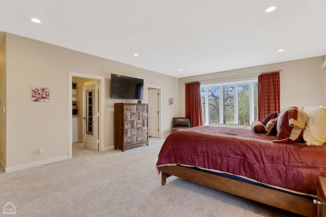 bedroom featuring light colored carpet