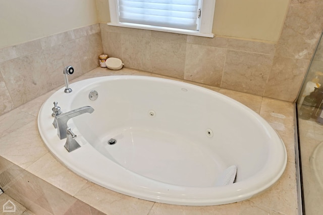 bathroom featuring a relaxing tiled tub