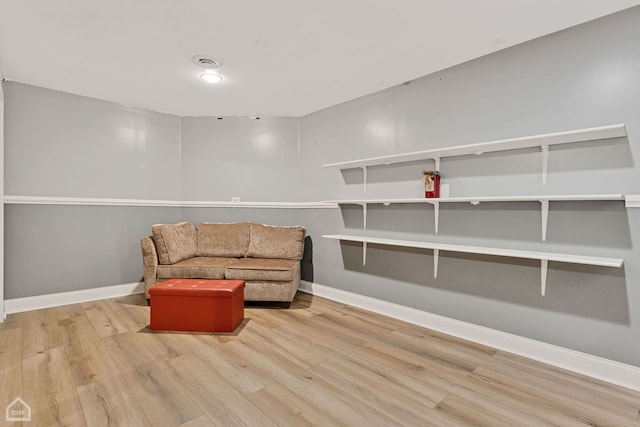 living area with light hardwood / wood-style flooring