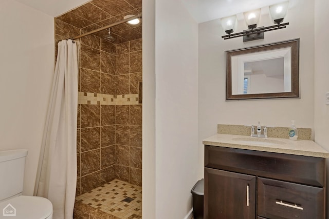 bathroom with a shower with shower curtain, vanity, and toilet