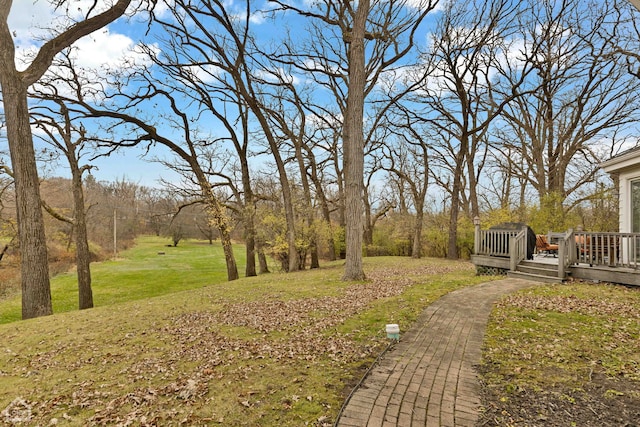 view of yard with a wooden deck