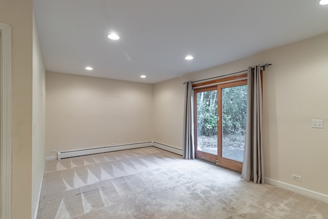 unfurnished room featuring light carpet and a baseboard radiator