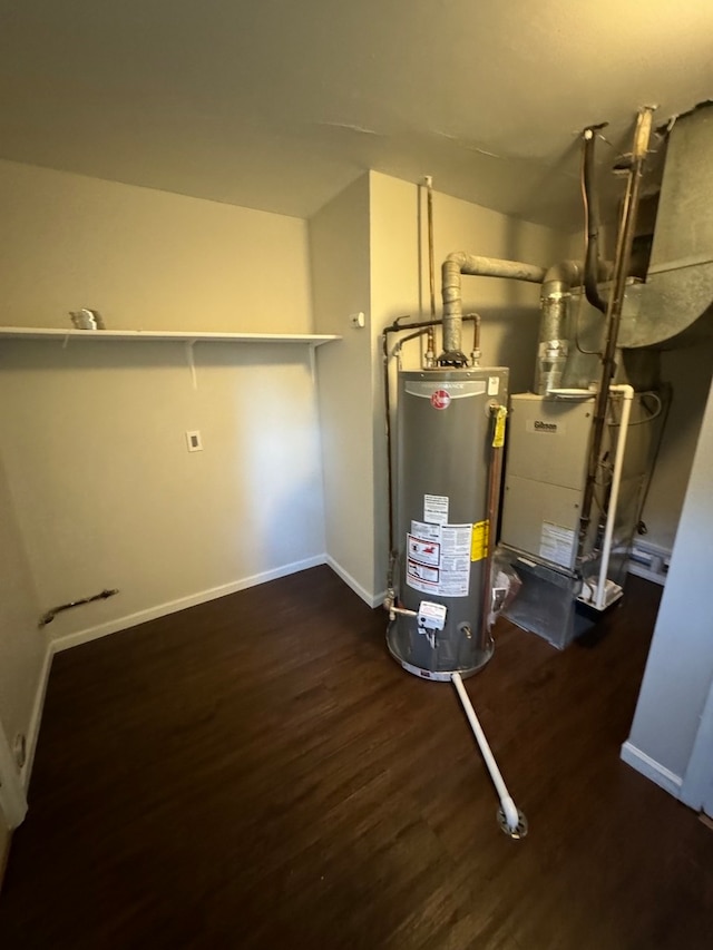 utility room featuring water heater