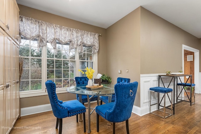 dining area featuring wood finished floors and baseboards