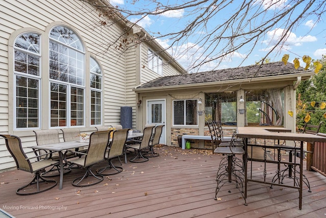 deck featuring outdoor dry bar and outdoor dining space