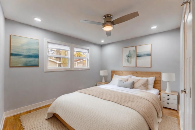 bedroom with ceiling fan and light wood-type flooring