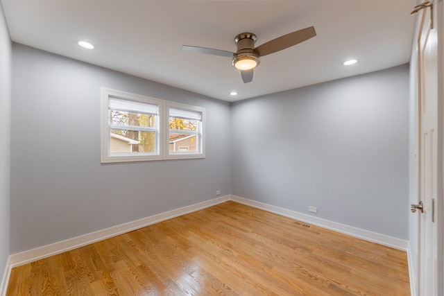 spare room featuring ceiling fan and light hardwood / wood-style floors