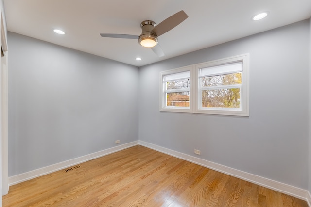 unfurnished room featuring ceiling fan and light hardwood / wood-style flooring