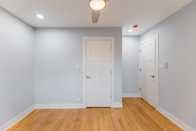 unfurnished room with ceiling fan and light hardwood / wood-style flooring