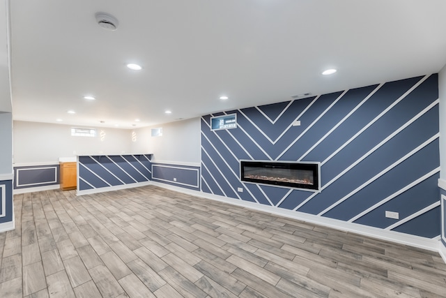 basement featuring wood-type flooring