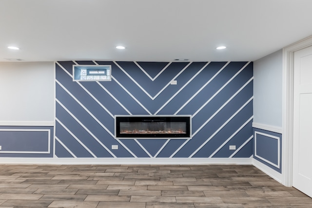 interior space with hardwood / wood-style flooring and a fireplace