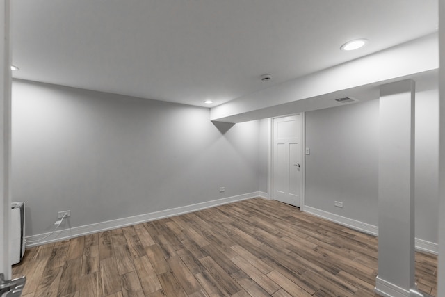 basement with hardwood / wood-style flooring