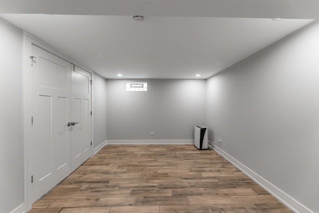 basement featuring light hardwood / wood-style floors