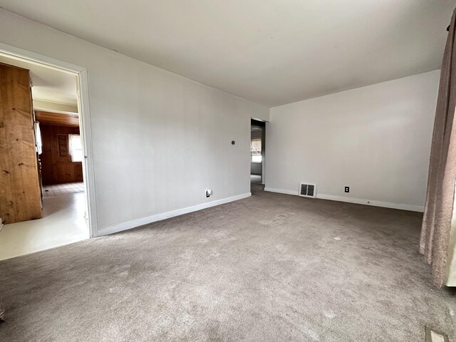 view of carpeted foyer entrance