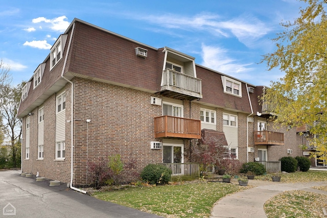 view of property with a wall mounted air conditioner